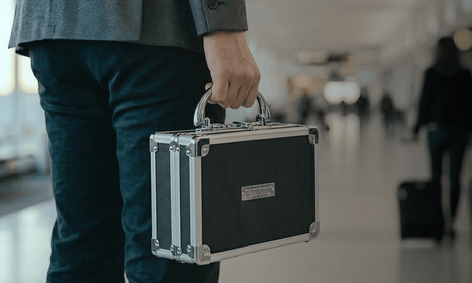 Durable locking medication bag by Vaultz being carried on travel, providing private prescription security on the go.